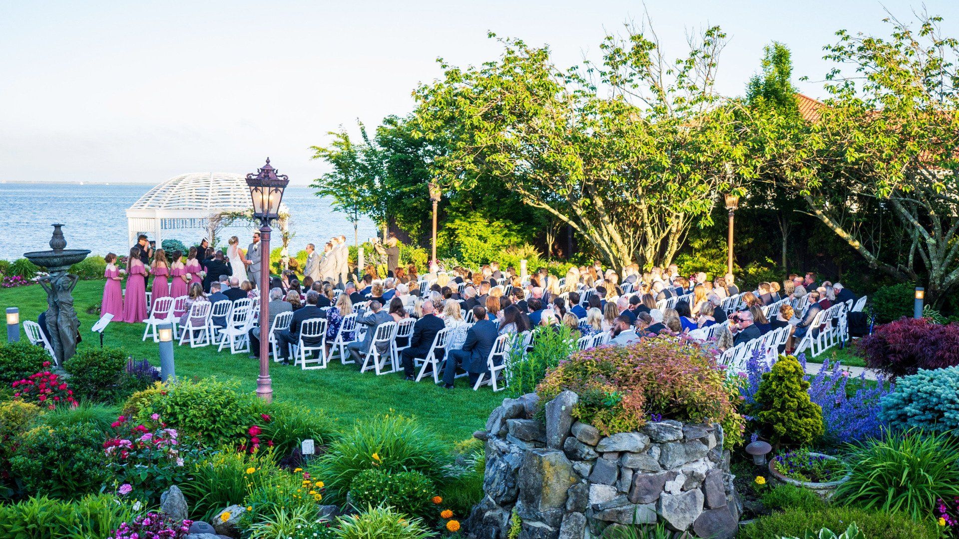 Outdoor Waterfront Ceremony at Riviera Waterfront Mansion Long Island wedding venue in Massapequa, NY