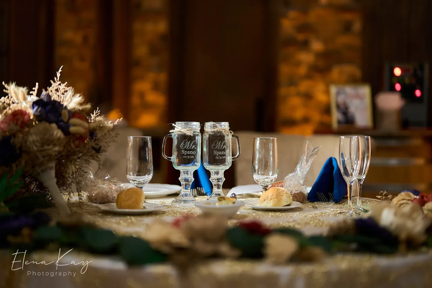 Sweetheart table with engraved glasses, florals, and place settings by Elena Kay Photography